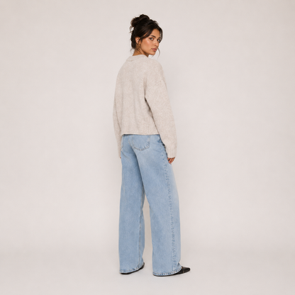 Women's beige knit jacket with crew neckline, zip front and long sleeves