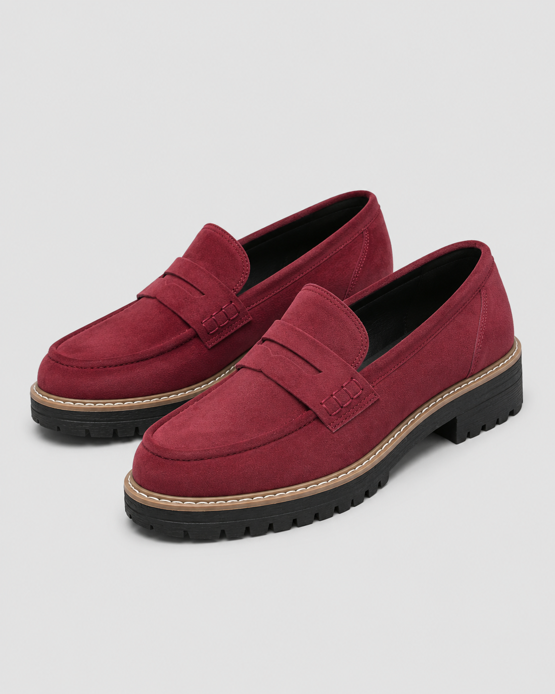 Women's slip-on loafers with penny straps, stitched trim and chunky lug soles