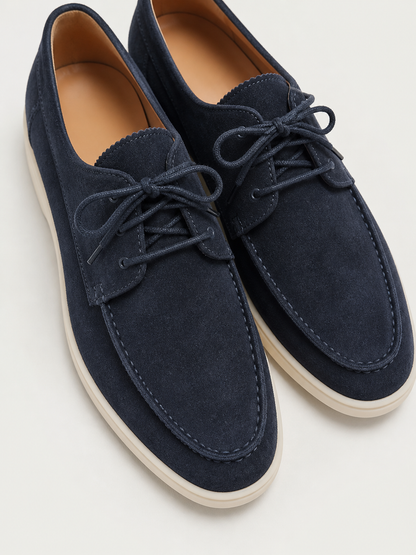 Men's lace-up loafers with moc toe stitching and contrasting flat soles