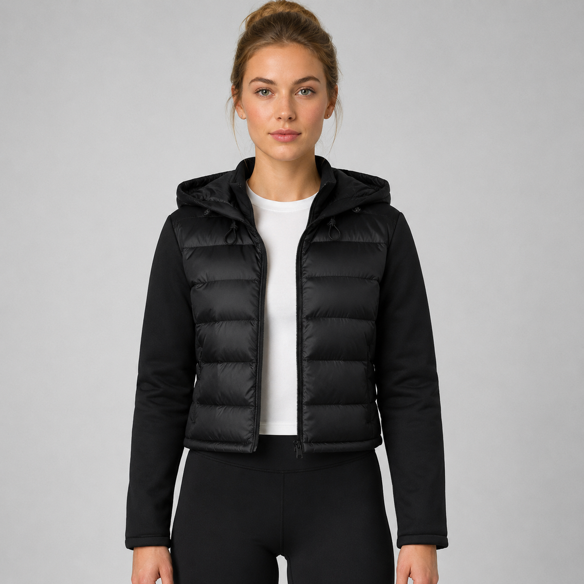 Women's black cropped hooded puffer jacket with long sleeves and front zip