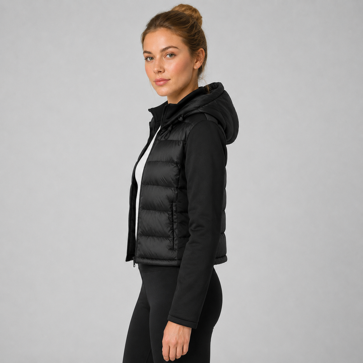 Women's black cropped hooded puffer jacket with long sleeves and front zip
