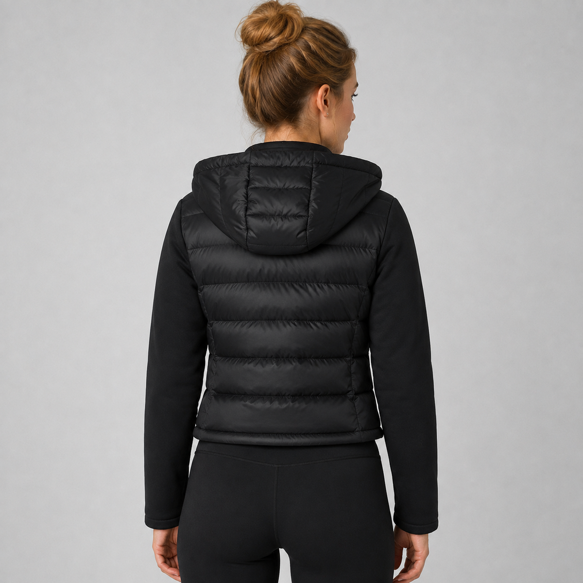 Women's black cropped hooded puffer jacket with long sleeves and front zip