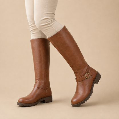 Women's tall boots with back zipper, buckle strap and lugged sole