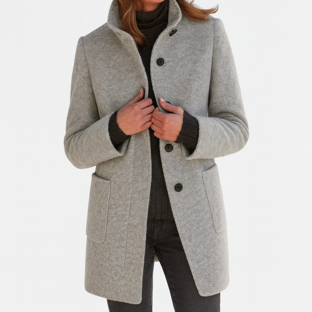 Women's solid winter coat with stand collar, button front, long sleeves and two patch pockets