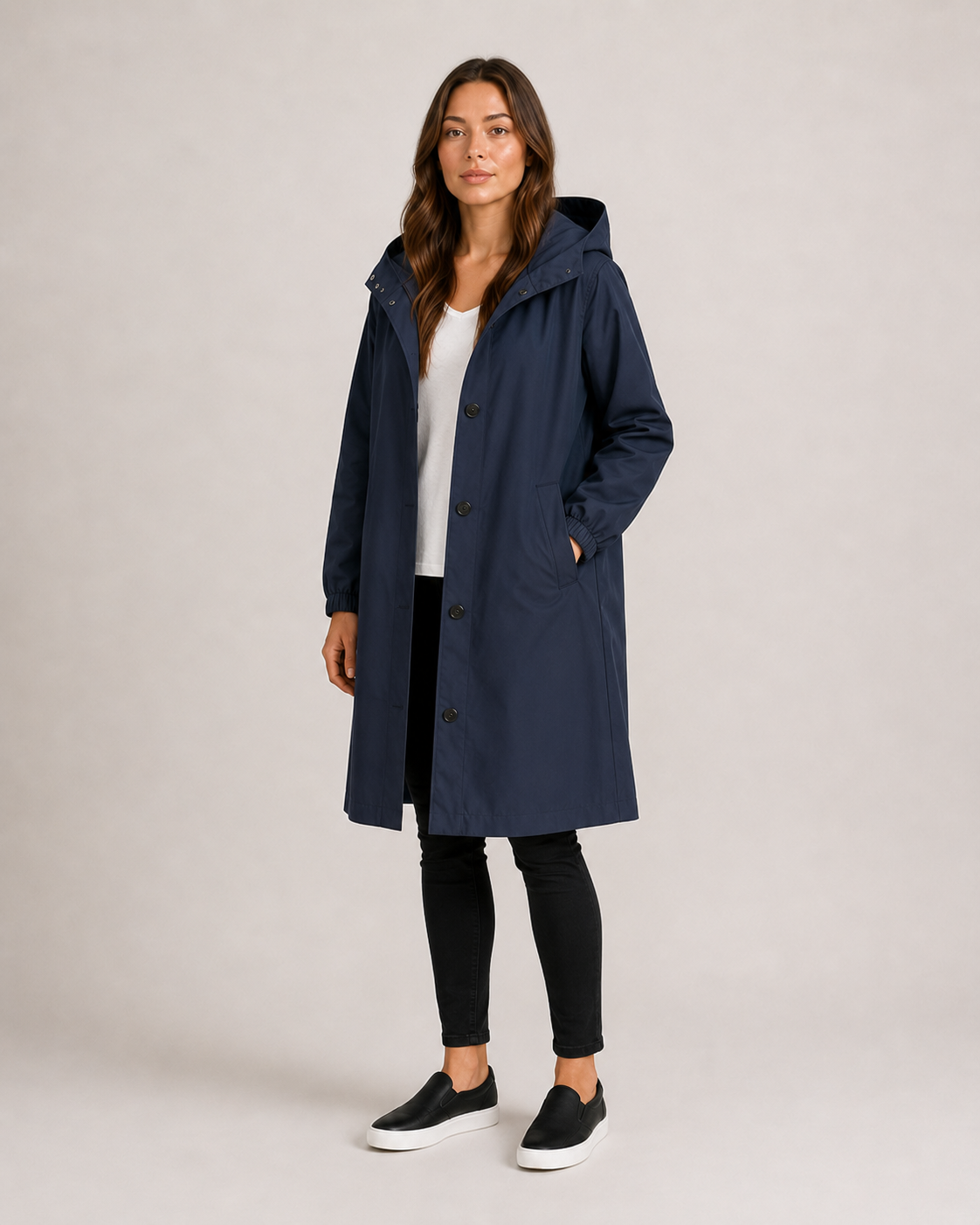 Women's hooded mid-thigh rain coat with button front and long sleeves