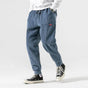Men's textured corduroy jogger trousers with elasticated ankle cuffs
