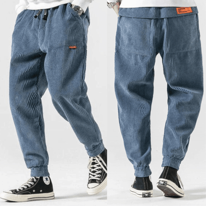 Men's textured corduroy jogger trousers with elasticated ankle cuffs