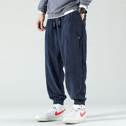 Men's textured corduroy jogger trousers with elasticated ankle cuffs