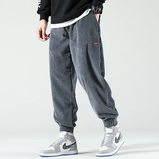 Men's textured corduroy jogger trousers with elasticated ankle cuffs