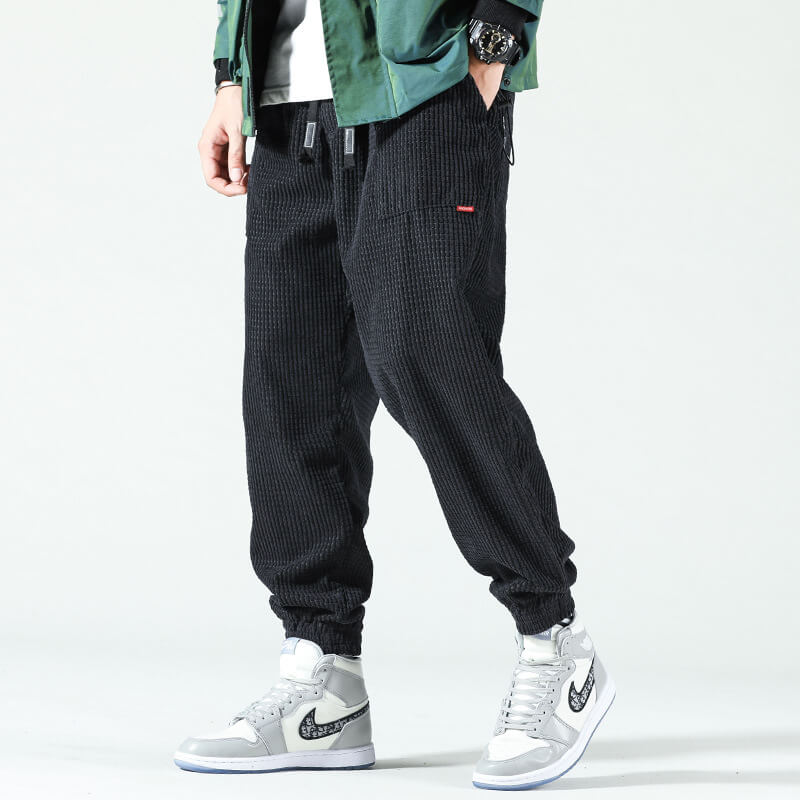 Men's textured corduroy jogger trousers with elasticated ankle cuffs