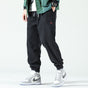 Men's textured corduroy jogger trousers with elasticated ankle cuffs