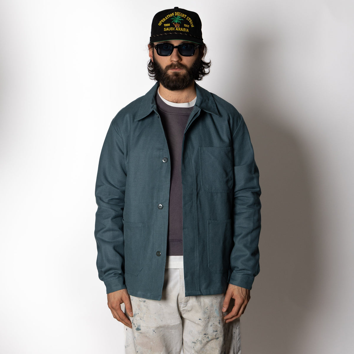 Men's green utility jacket with spread collar, long sleeves and front patch pockets