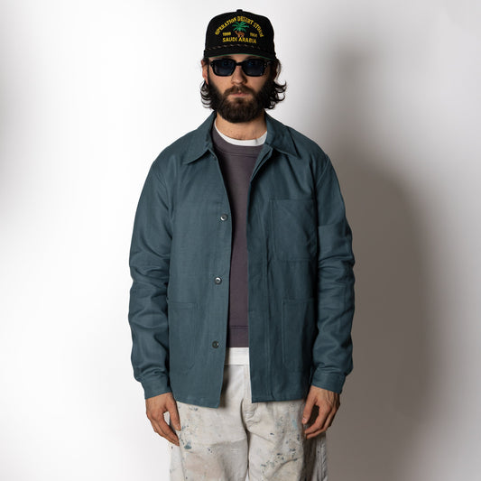 Men's green utility jacket with spread collar, long sleeves and front patch pockets