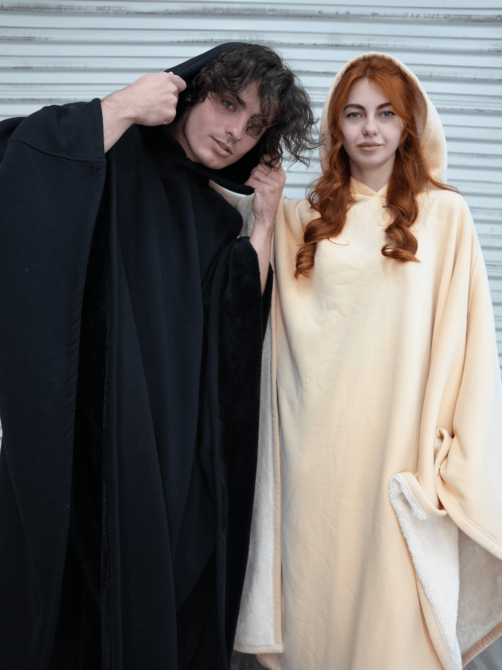 Oversized hooded poncho with plush-looking lining and wide sleeves