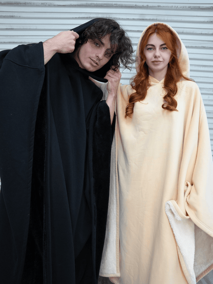 Oversized hooded poncho with plush-looking lining and wide sleeves