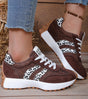 Low-top striped lace-up sneakers with contrasting panels and textured soles