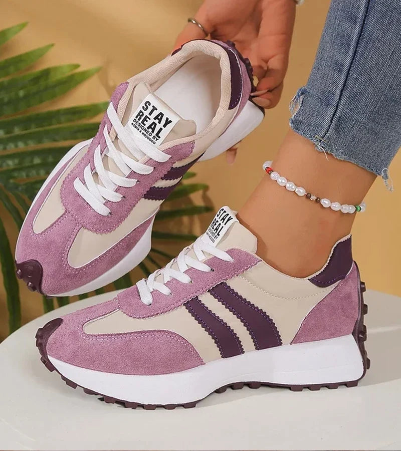 Low-top striped lace-up sneakers with contrasting panels and textured soles