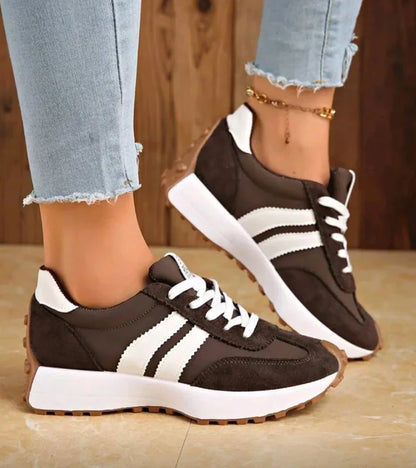Low-top striped lace-up sneakers with contrasting panels and textured soles