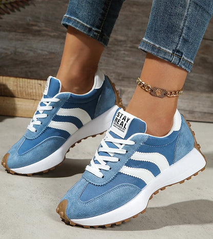 Low-top striped lace-up sneakers with contrasting panels and textured soles