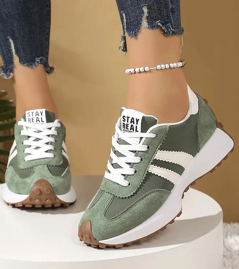 Low-top striped lace-up sneakers with contrasting panels and textured soles