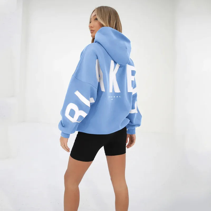 Women's hooded pullover with graphic back and sleeve print