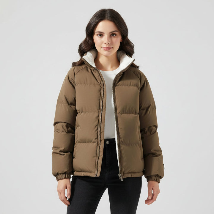 Women's hooded quilted puffer jacket with contrasting fleece-like lining and zip front