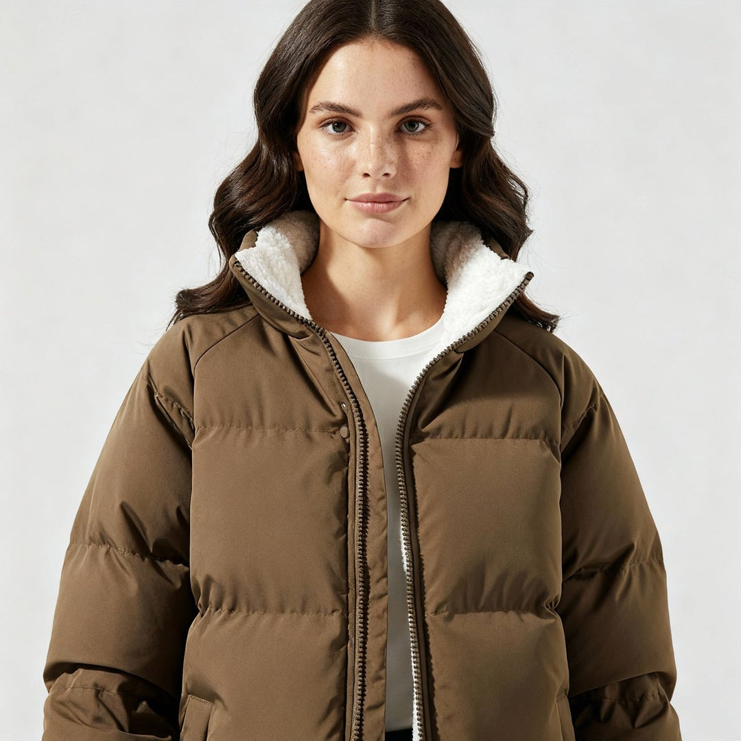 Women's hooded quilted puffer jacket with contrasting fleece-like lining and zip front