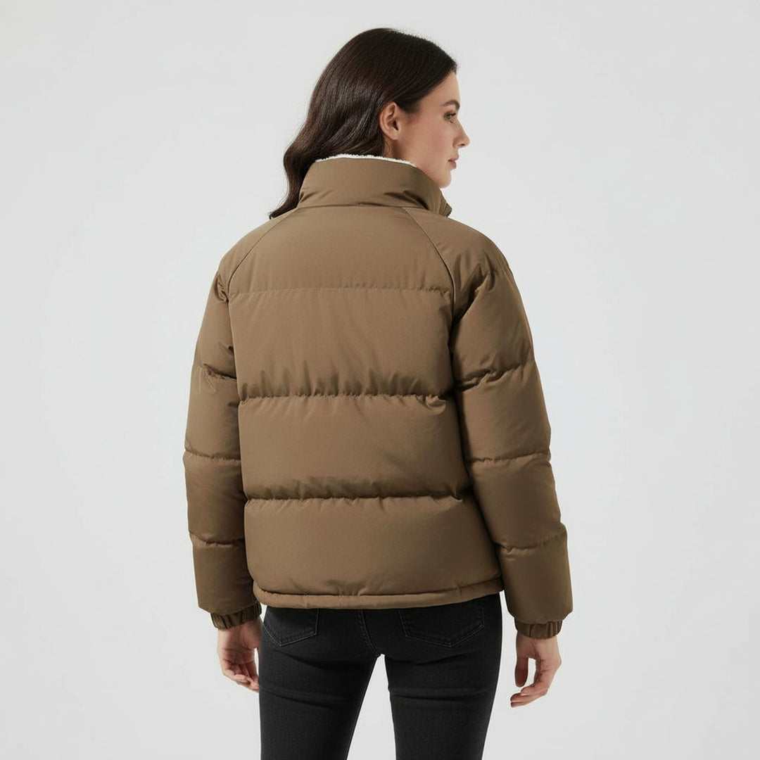 Women's hooded quilted puffer jacket with contrasting fleece-like lining and zip front