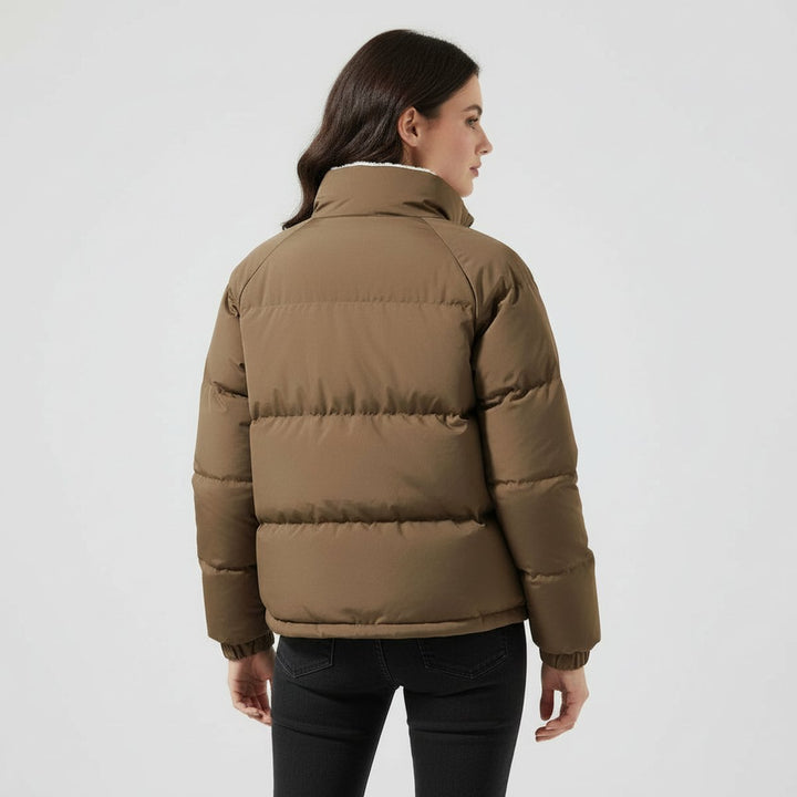 Women's hooded quilted puffer jacket with contrasting fleece-like lining and zip front