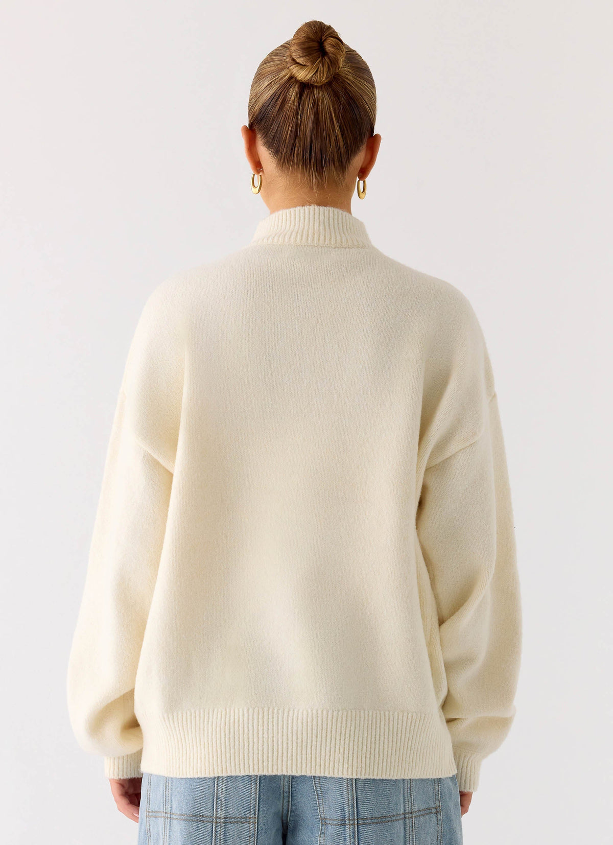 Women's ivory knit jacket with mock neck, front zip and ribbed trims