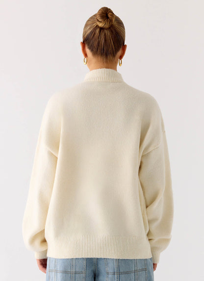 Women's ivory knit jacket with mock neck, front zip and ribbed trims