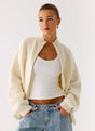 Women's ivory knit jacket with mock neck, front zip and ribbed trims