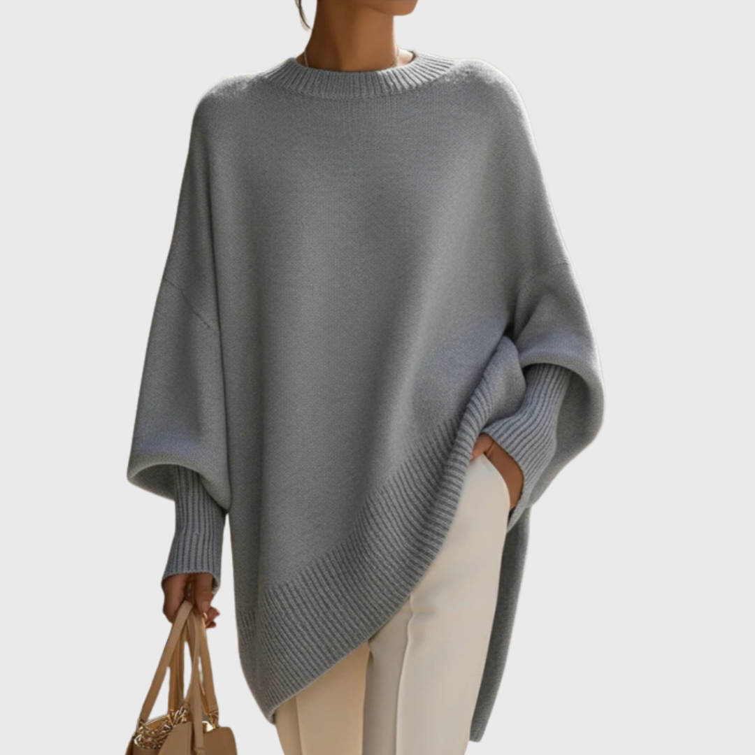 Women's oversized poncho sweater with crew neck and ribbed cuffs