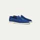 Men's blue slip-on loafers with textured finish and off-white flat soles