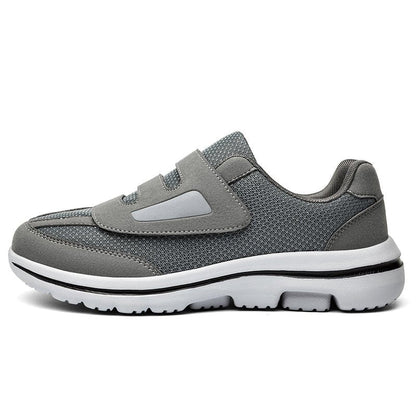 Women's wide toe slip-on sneakers with hook-and-loop straps and layered soles