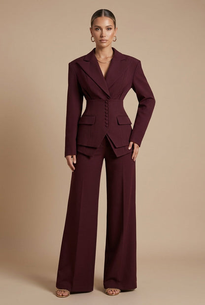 Women's tailored two-piece suit with peaked lapel jacket and wide-leg trousers