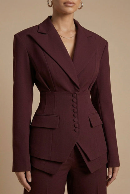 Women's tailored two-piece suit with peaked lapel jacket and wide-leg trousers