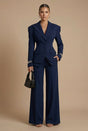 Women's tailored two-piece suit with peaked lapel jacket and wide-leg trousers