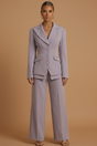 Women's tailored two-piece suit with peaked lapel jacket and wide-leg trousers