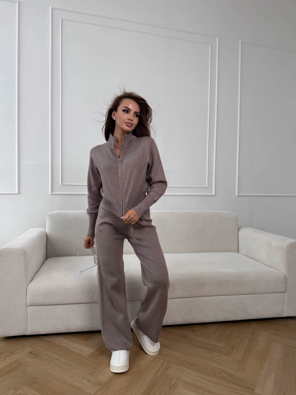 Woman wearing a two-piece knit sweater and wide-leg trouser set