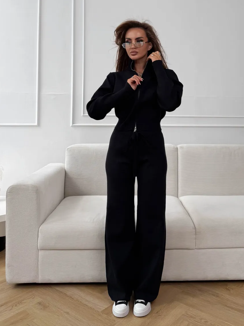 Woman wearing a two-piece knit sweater and wide-leg trouser set