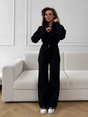 Woman wearing a two-piece knit sweater and wide-leg trouser set