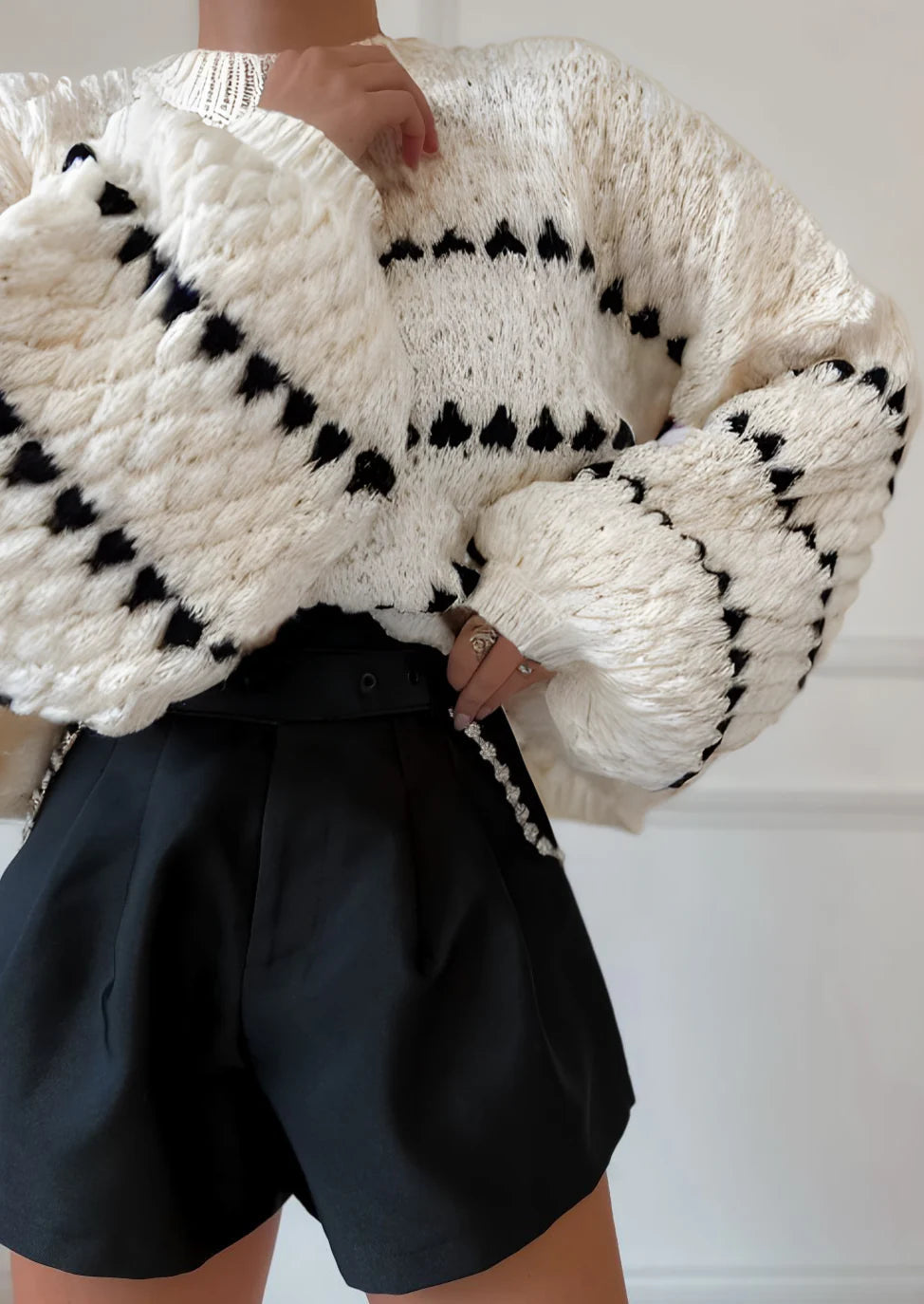 Women's textured crew neck sweater with contrasting geometric pattern