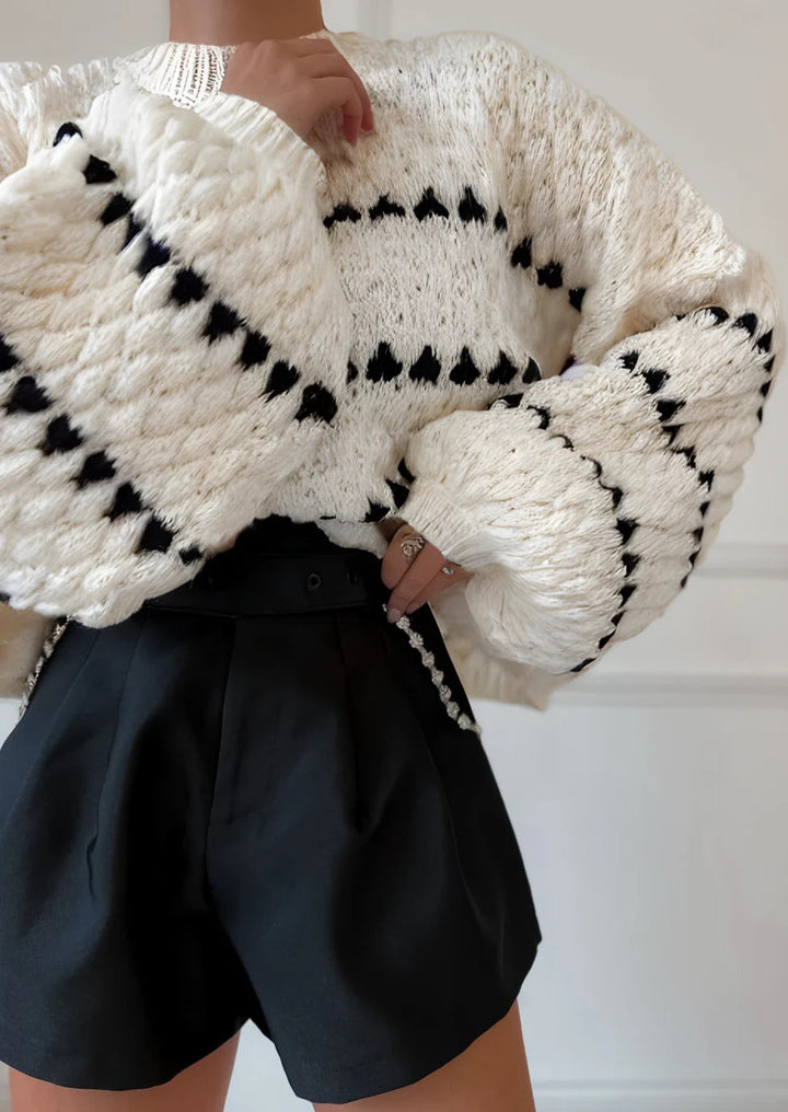 Women's textured crew neck sweater with contrasting geometric pattern