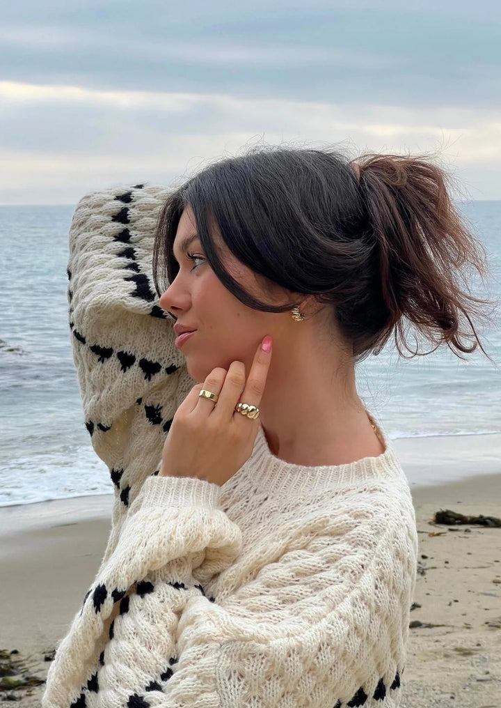 Women's textured crew neck sweater with contrasting geometric pattern