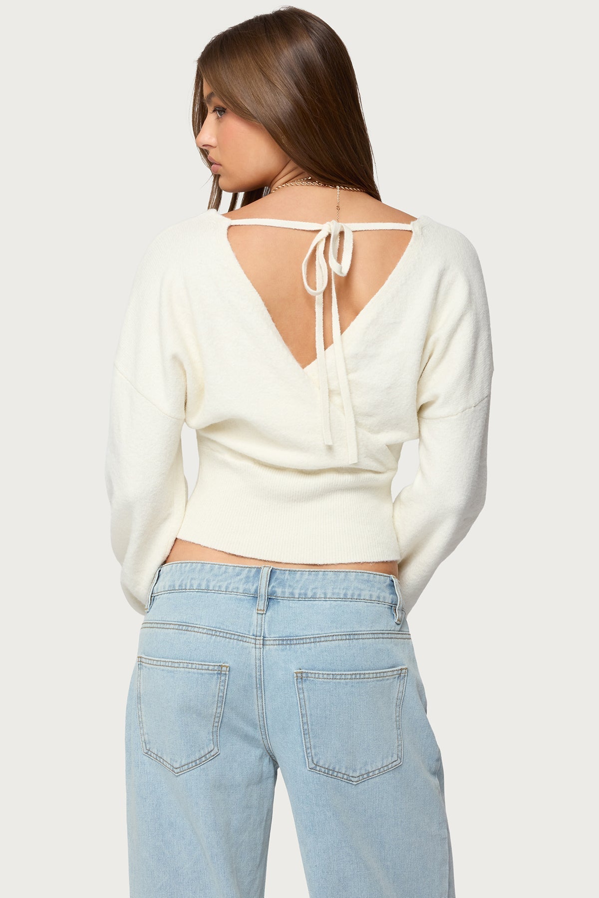 Women's cropped wrap sweater with V-neckline and long sleeves