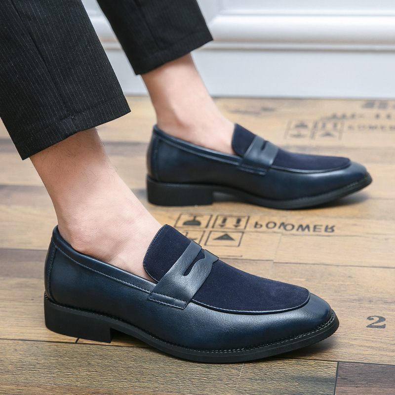 Men's penny loafers with a rounded toe, vamp strap and low heel