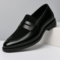 Men's penny loafers with a rounded toe, vamp strap and low heel