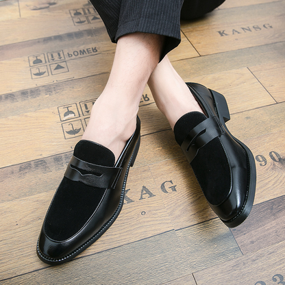 Men's penny loafers with a rounded toe, vamp strap and low heel