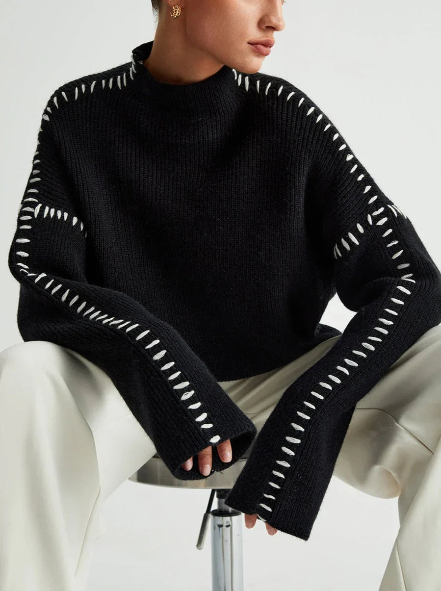 Women's crew neck knit sweater with contrast stitch detailing and long sleeves